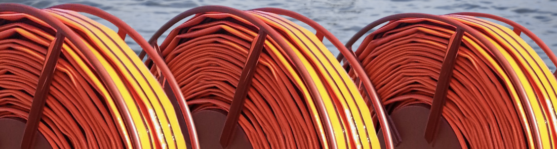Picture of Oroflex offshore hose stored on reels onsite.